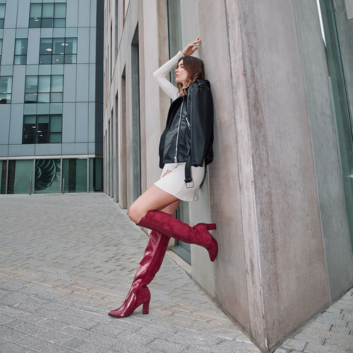 Heeled knee-high boots combined burgundy faux croc leather with faux suede. 